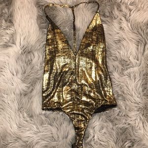 gold and black bodysuit